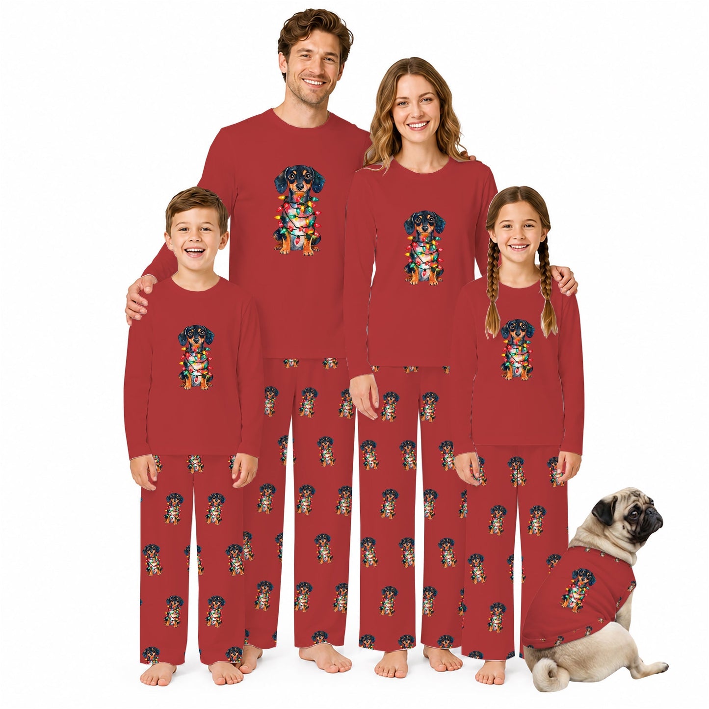 A family of four wearing matching Red long-sleeve pajamas with a colorful dog graphic on the chest and a repeating dog print down the front, standing barefoot against a White background with a small matching dog sitting beside them.