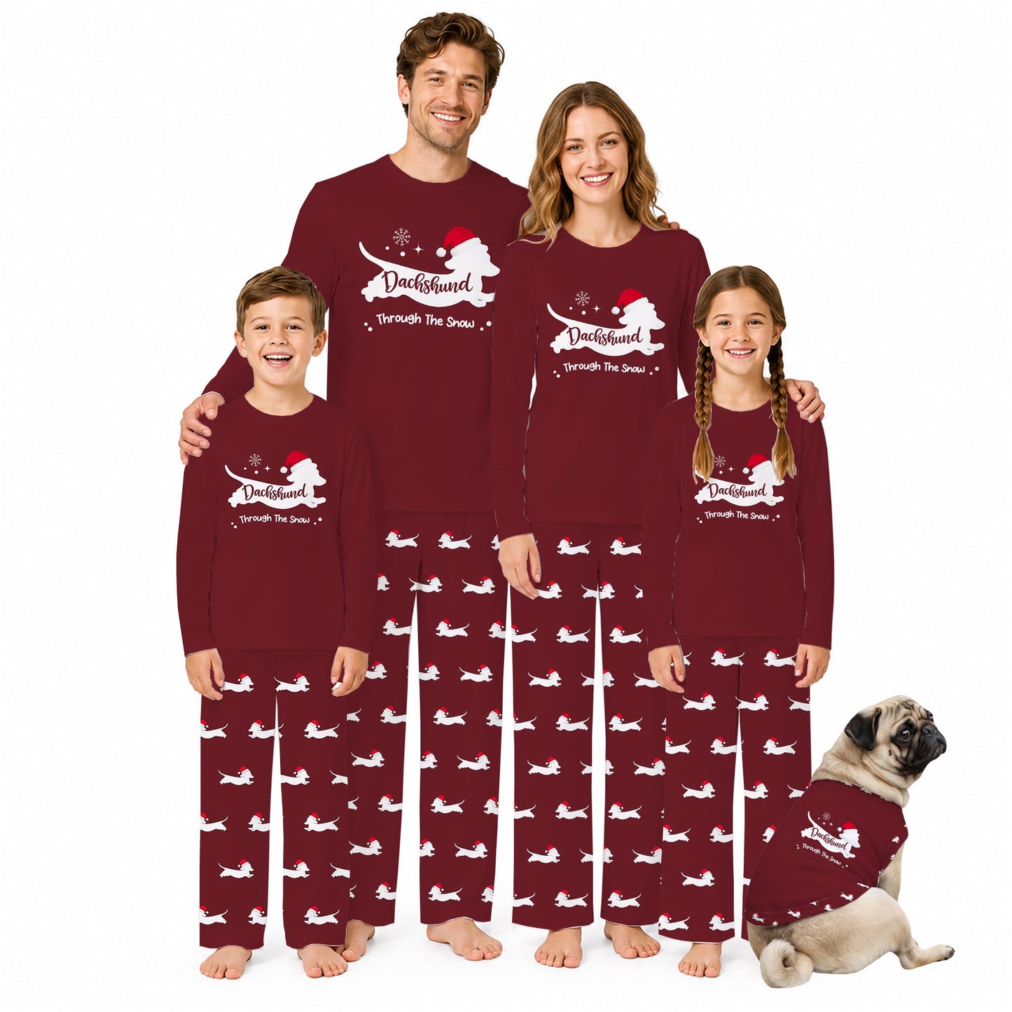 A family of four wearing matching burgundy and White Christmas-themed pajamas, with a small pug dog sitting on the right wearing a matching pajama set. The pajamas feature a White Santa dog graphic and the text 'Duffyjamm through the Snow' on the shirts, and a repeating White Santa dog pattern on the pants.