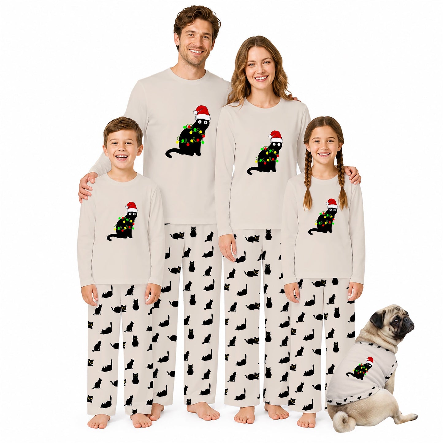 A family of four wearing matching Christmas-themed pajamas stands together on a white background, with a small dog sitting beside them. The pajamas are light beige with black cat silhouettes and a central graphic of a black cat wearing a red Santa hat and green Christmas lights.
