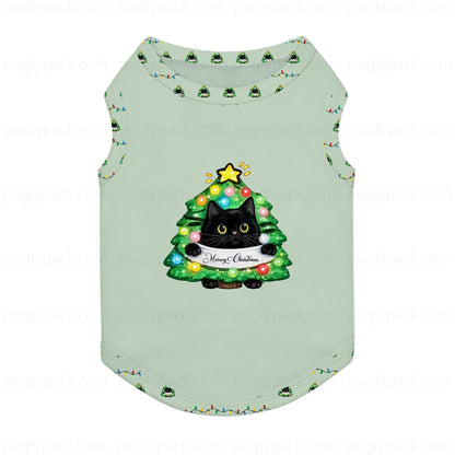 A light sage Green pet tank top featuring a festive Christmas tree graphic with a Black cat and a 'Merry Christmas' banner. The tank top is decorated with small Christmas tree prints along the collar and sleeve cuffs, and is shown against a White background with faint 'puglypack.
