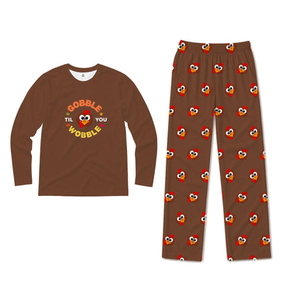 A two-piece children's pajama set on a White background, featuring a brown long-sleeve shirt with a 'Gobble Til You Wobble' turkey graphic and matching brown pants with an all-over Elmo print.