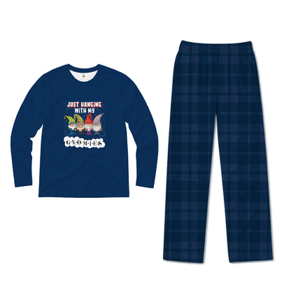 A two-piece pajama set on a plain White background, featuring a royal Blue long-sleeve shirt with a Christmas graphic and matching Blue pants with a soccer ball and Santa hat pattern.