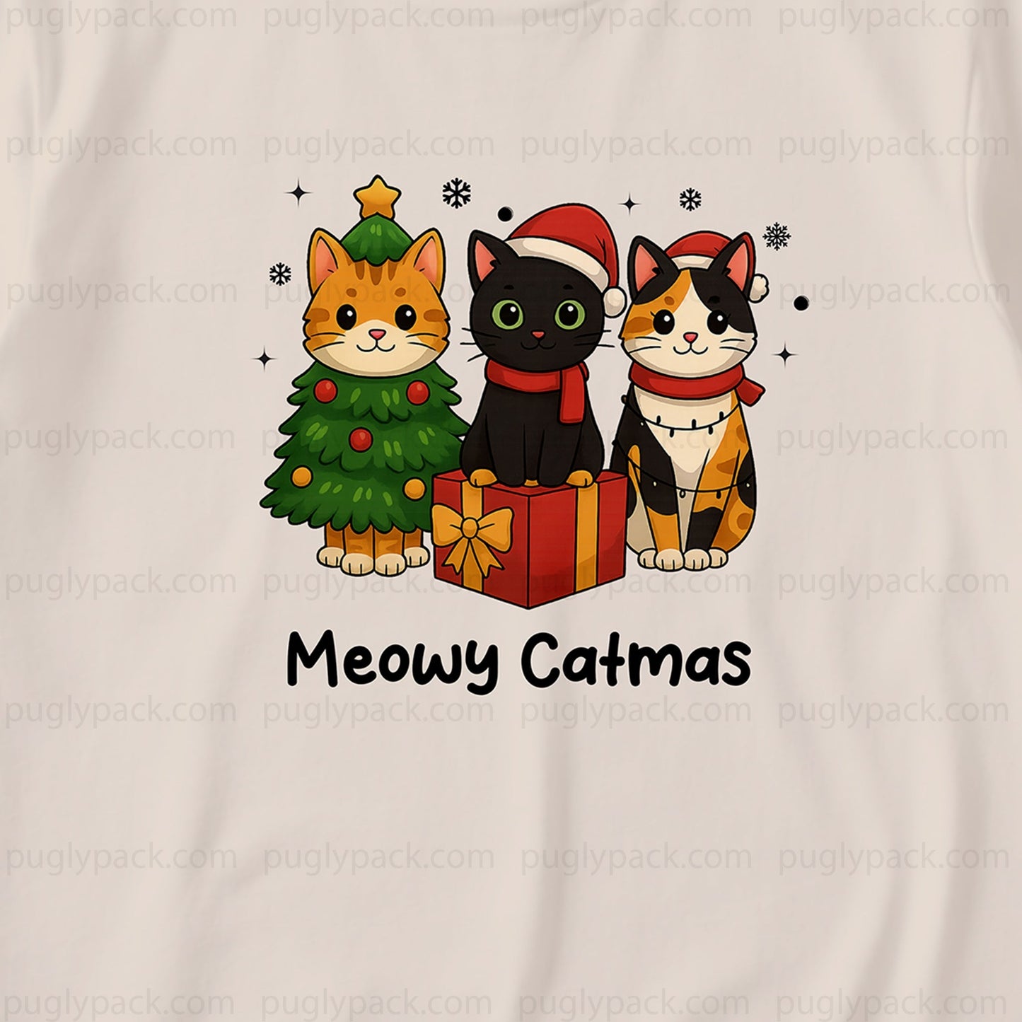 A White t-shirt featuring a cartoon graphic of three cats dressed in Christmas attire: an orange tabby cat next to a Green Christmas tree, a Black cat in a Santa hat, and a calico cat in a Santa hat sitting next to a Red gift box. The text 'Meowy Catmas' is printed below the illustration.