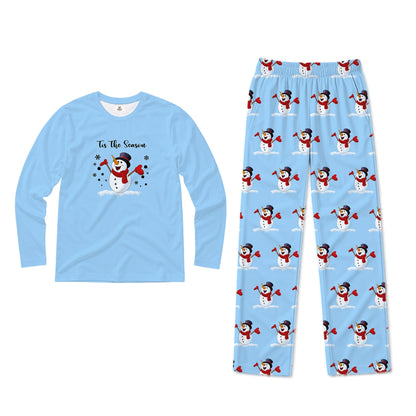 A two-piece pajama set on a plain White background, featuring a light Blue long-sleeve shirt with a winter snowman graphic and text, paiRed with matching light Blue pants coveRed in a repeating snowman print.